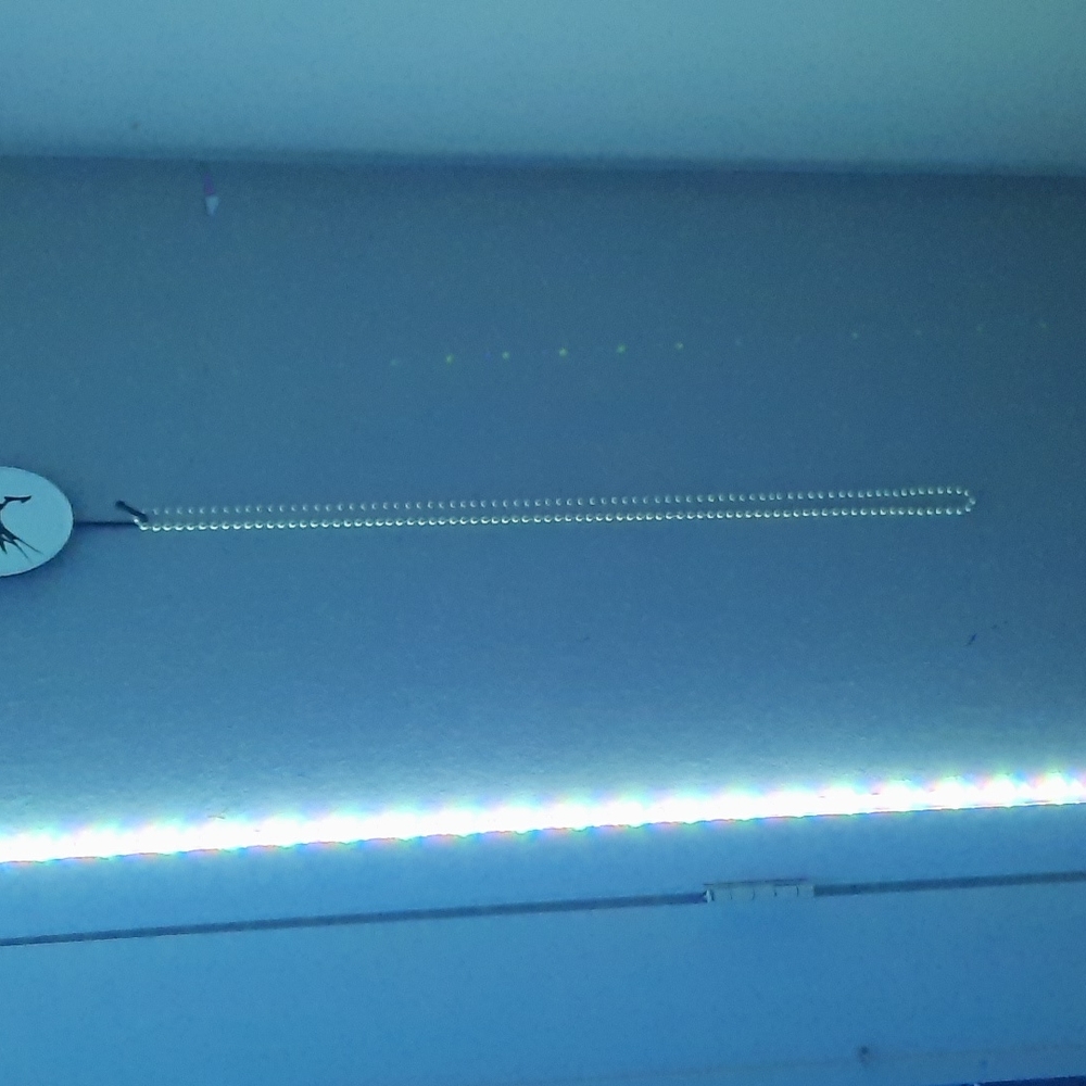 Long strand of fake dress pearls